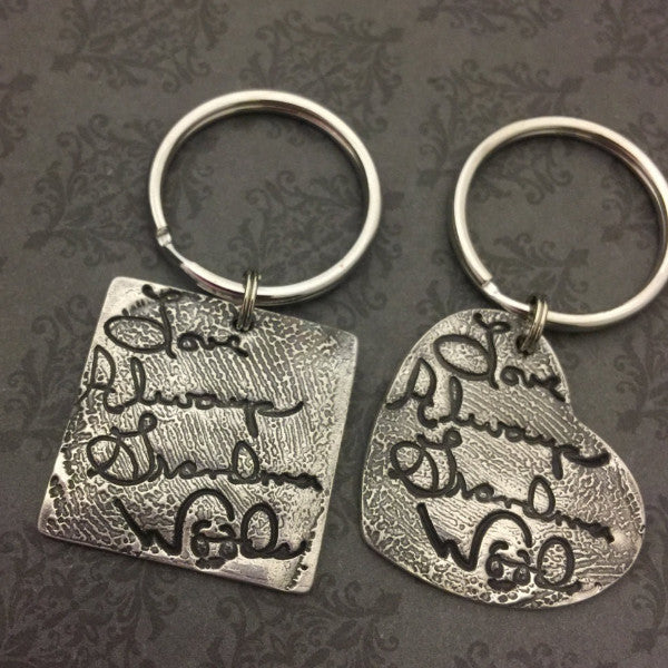 Handwriting layered over Fingerprint Keychains