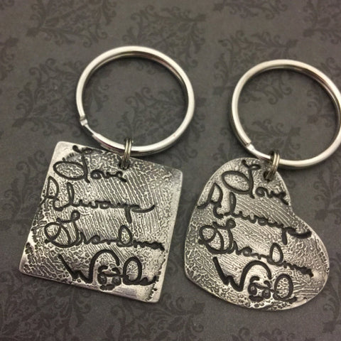 Handwriting layered over Fingerprint Keychains